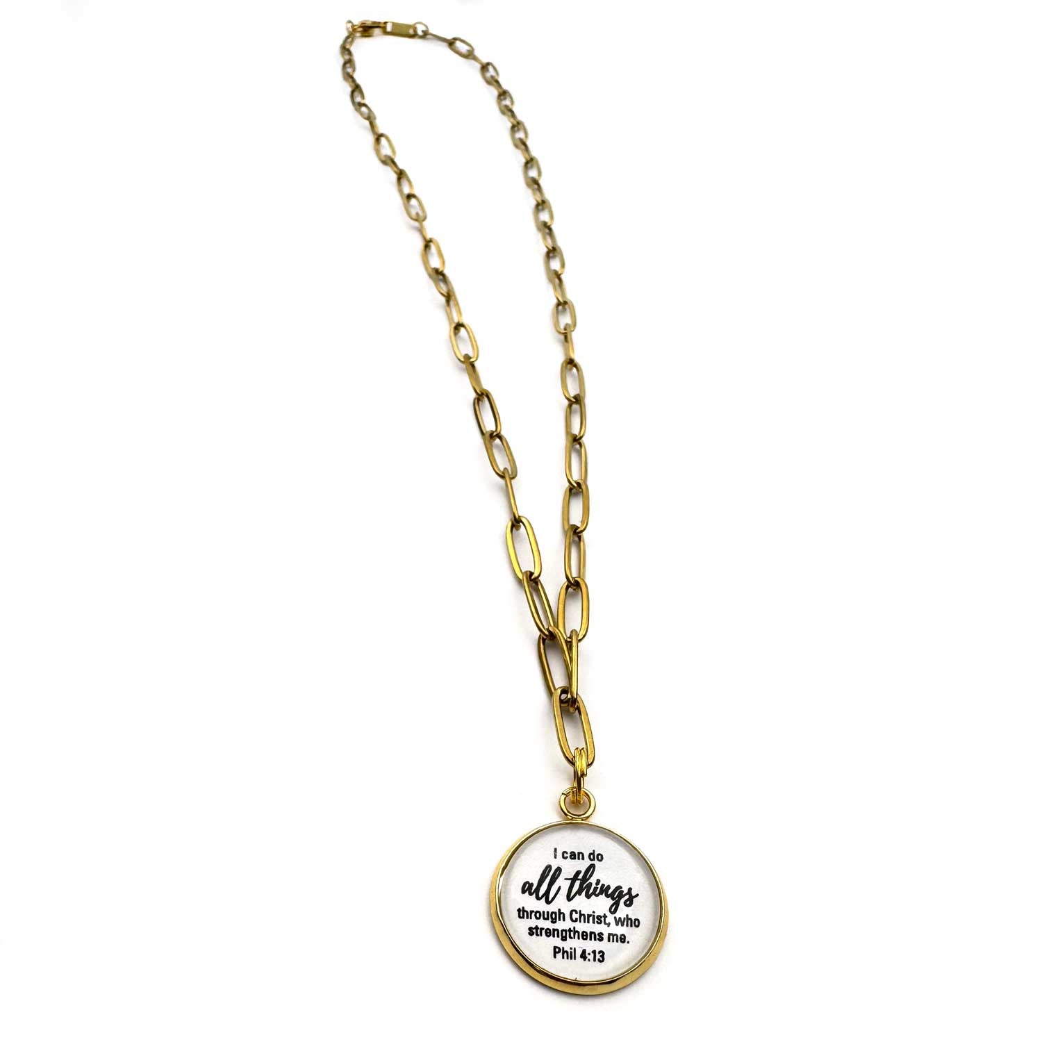 Gold paperclip necklace with a charm featuring "I can do all things through Christ, who strengthens me."