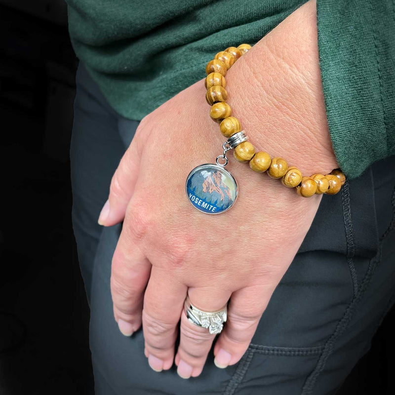 U.S. National Parks Wood Bead Stretch Bracelet with Glass Charm on Wrist