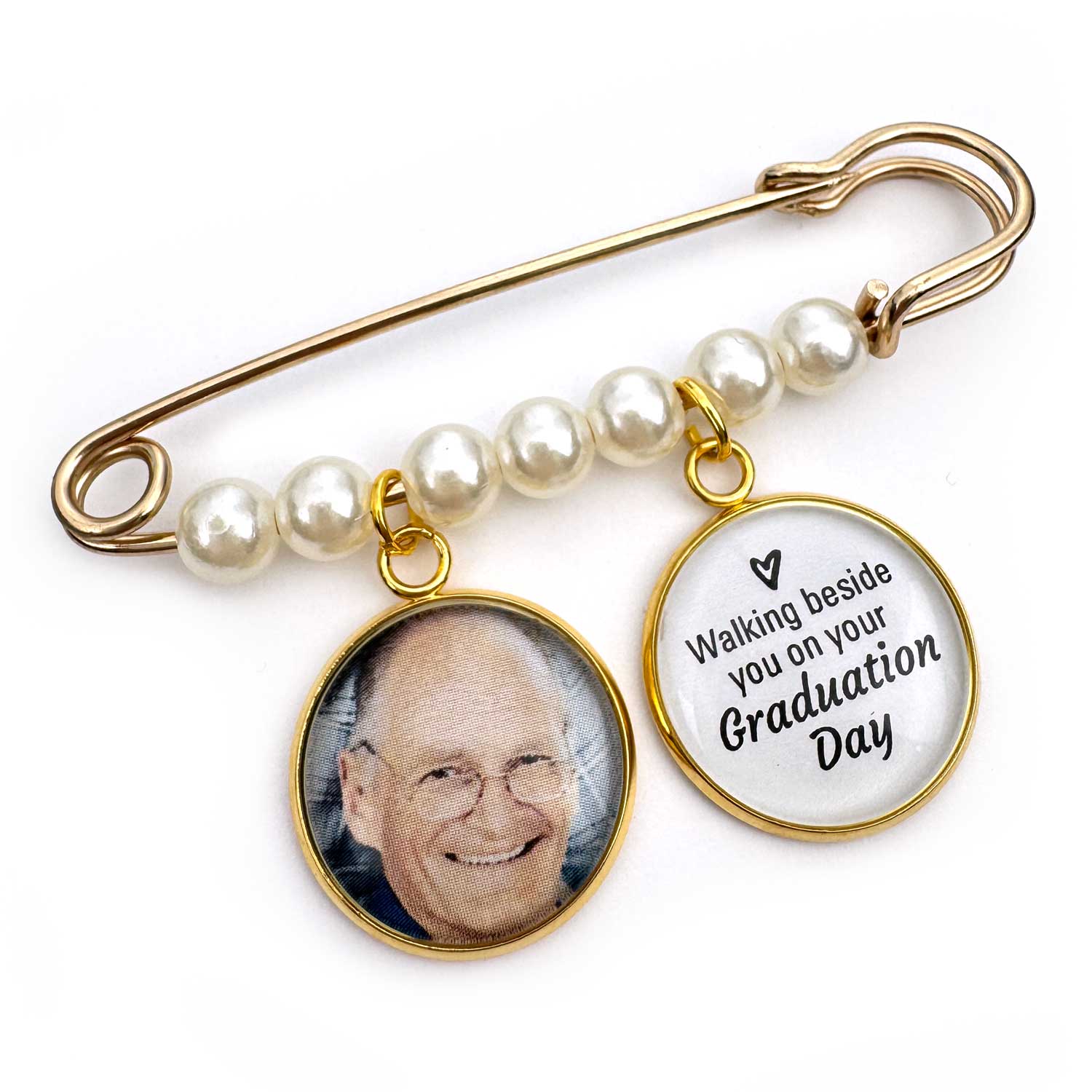 Brooch with photo charm and 'Walking beside you on your Graduation Day' message on a white background