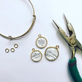 Adding ScriptCharms Designer Charms to a bangle bracelet with needlenose pliers