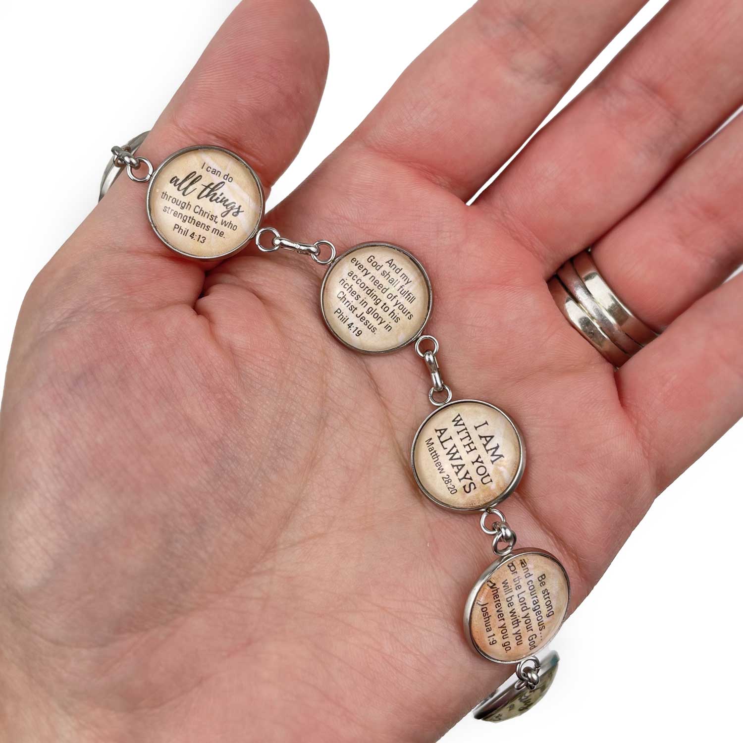 ScriptCharms 6-charm stainless steel bracelet in hand