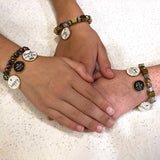 girls modeling the Christian Charm beaded bracelets they made